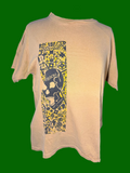 A mustard yellow short-sleeve t-shirt displayed on a mannequin torso, featuring a vertical graphic print on the front with a skull and the word 'VISION' surrounded by yellow graffiti-style patterns.