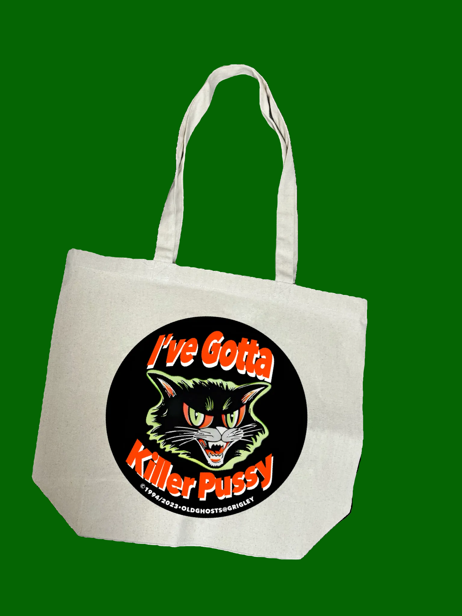Tote bag with a graphic of a cat and text on a green background