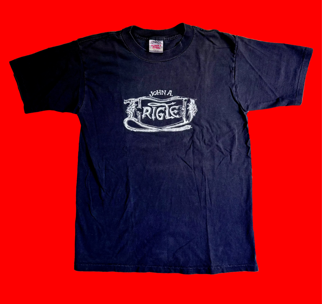 Black Grigley DAMNED Logo Tee Shirt on a red background