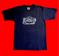 Black Grigley DAMNED Logo Tee Shirt on a red background