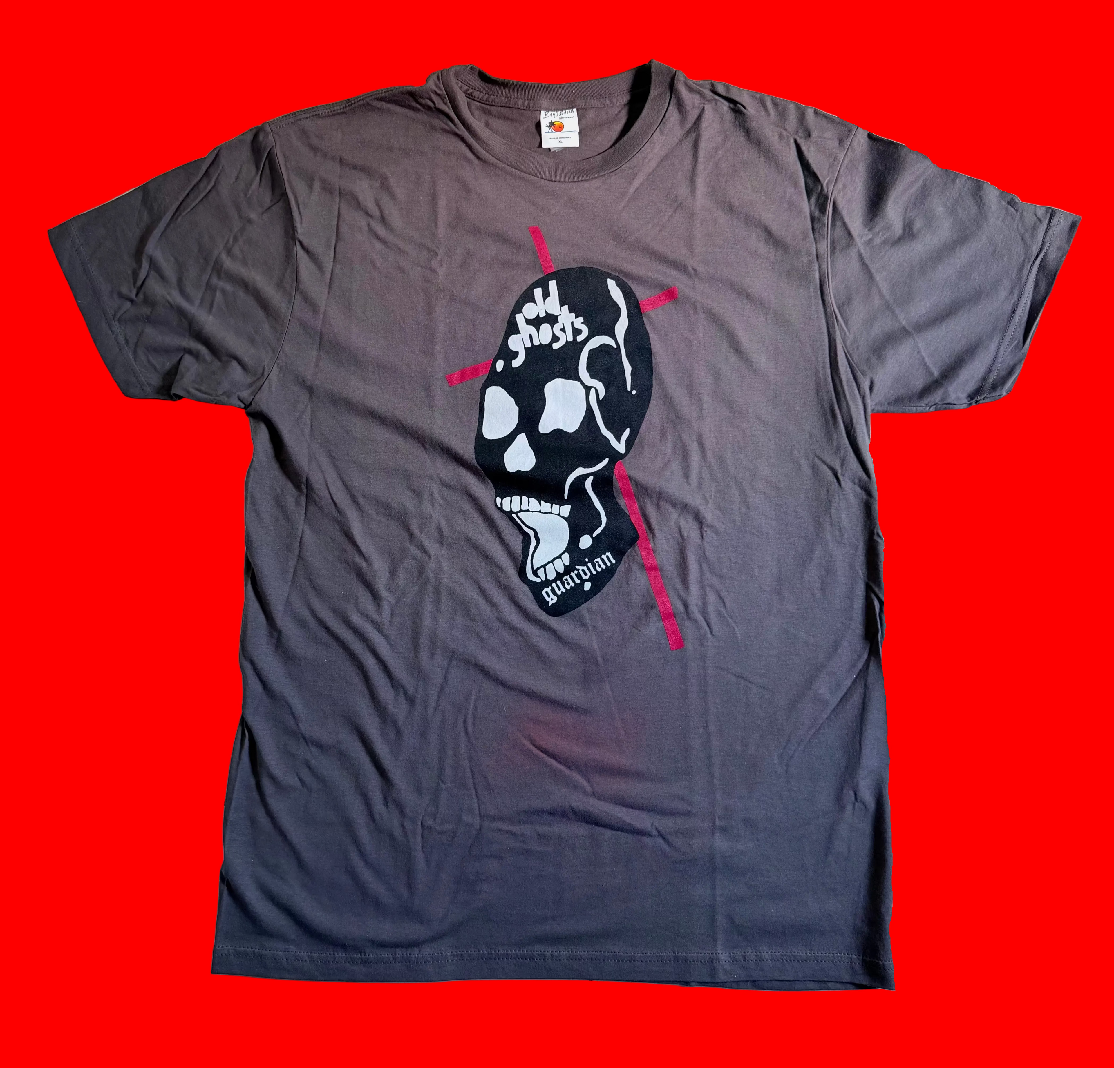 Gray t-shirt with a skull skateboard graphic design on a red background