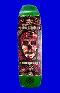 Skateboard deck with a colorful design featuring a skull on a solid background.