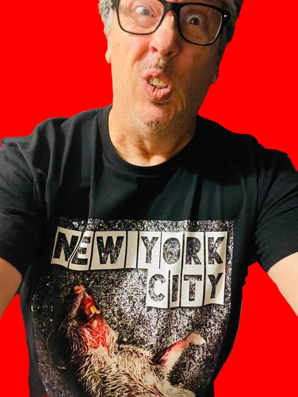 Person wearing a black t-shirt with 'New York City' print and graphic design.